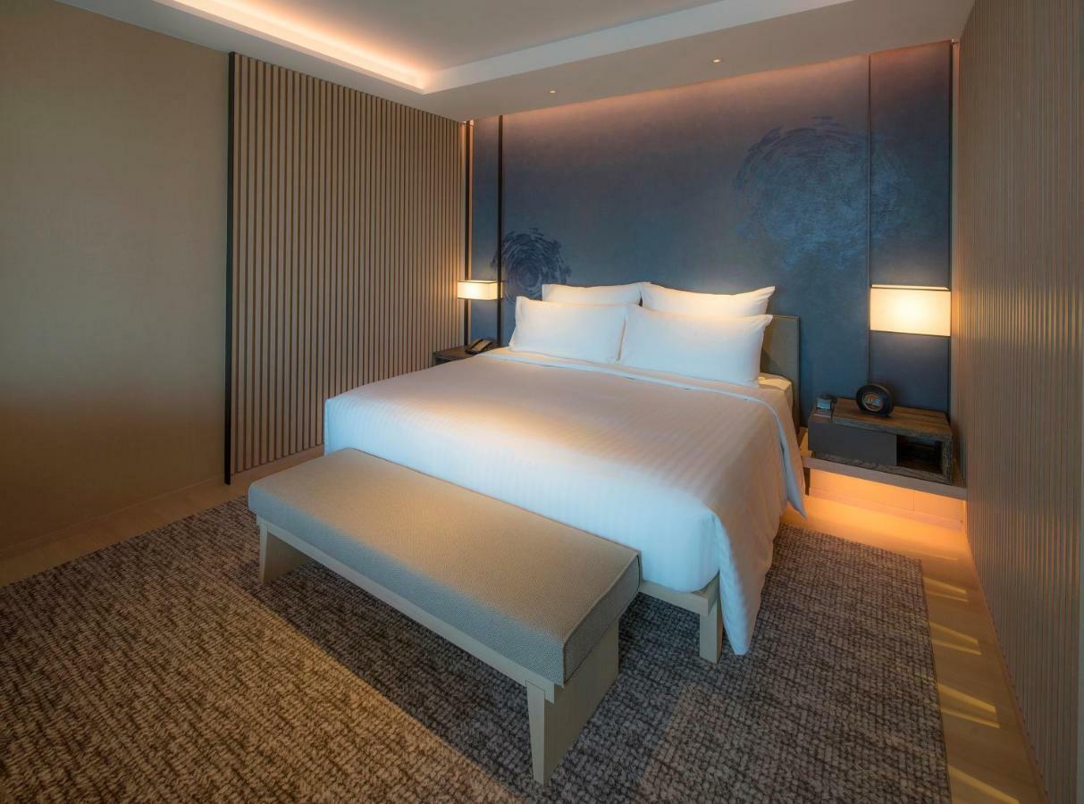 Mu Jiaoxi Hotel Exterior foto A bedroom at the hotel